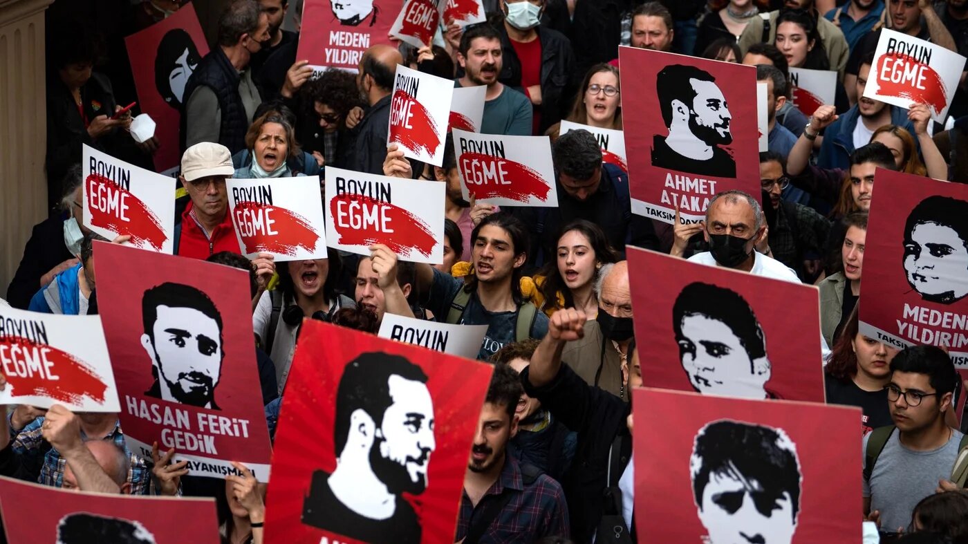 Protesters hold placards and shout slogans in Istanbul on April 26, 2022 during a rally in support of civil society leader Osman Kavala (AFP)