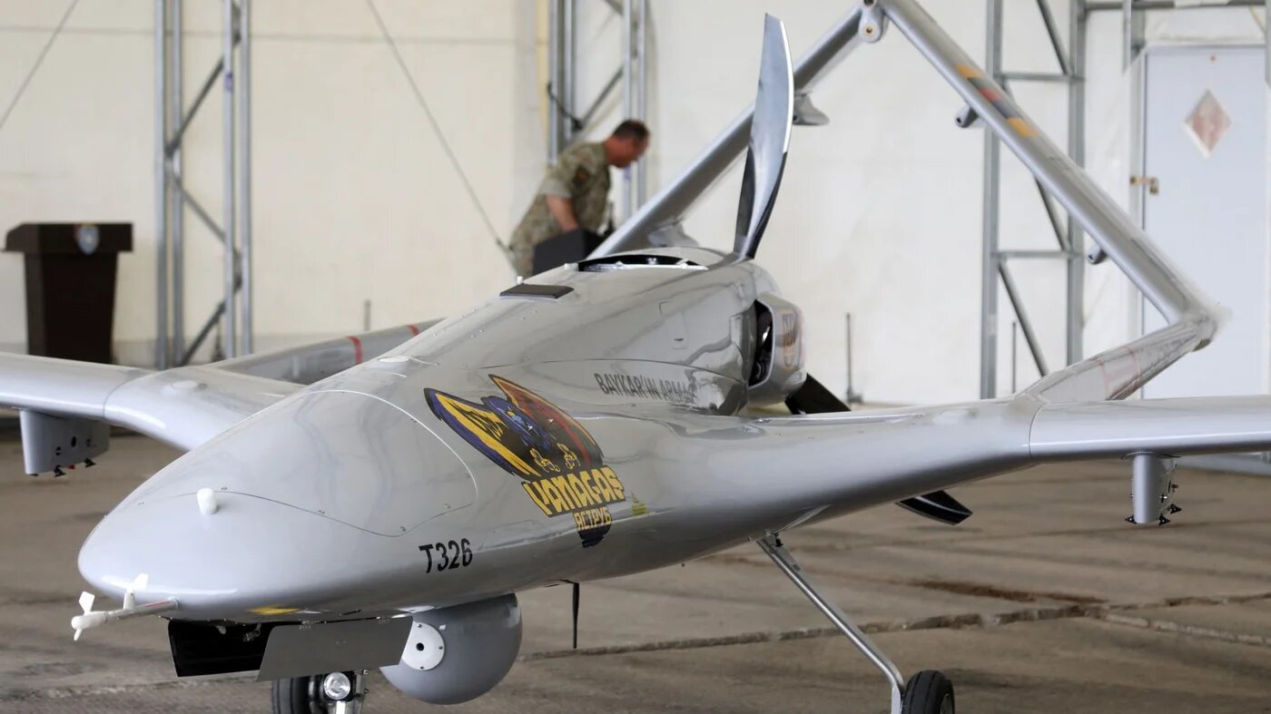 A Turkish Bayraktar TB2 combat drone is on view during a presentation at the Lithuanian Air Force Base in Siauliai, Lithuania, on July 6, 2022 (AFP)