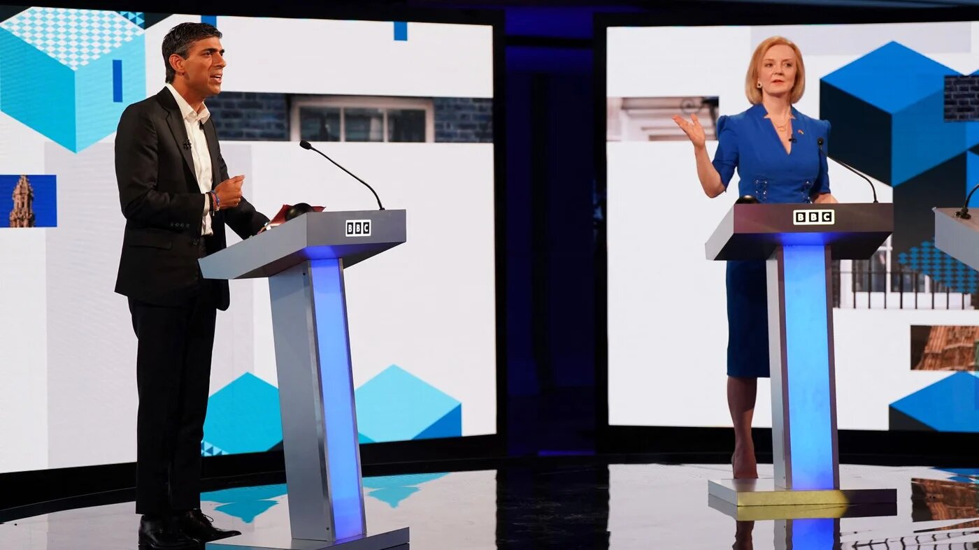 Britain's Foreign Secretary Liz Truss (R) and former chancellor to the exchequer Rishi Sunak, contenders to become the country's next prime minister, take part in the BBC's 'The UK's Next Prime Minister: The Debate' in Victoria Hall in Stoke-on-Trent, central England, on July 25, 2022 (AFP)