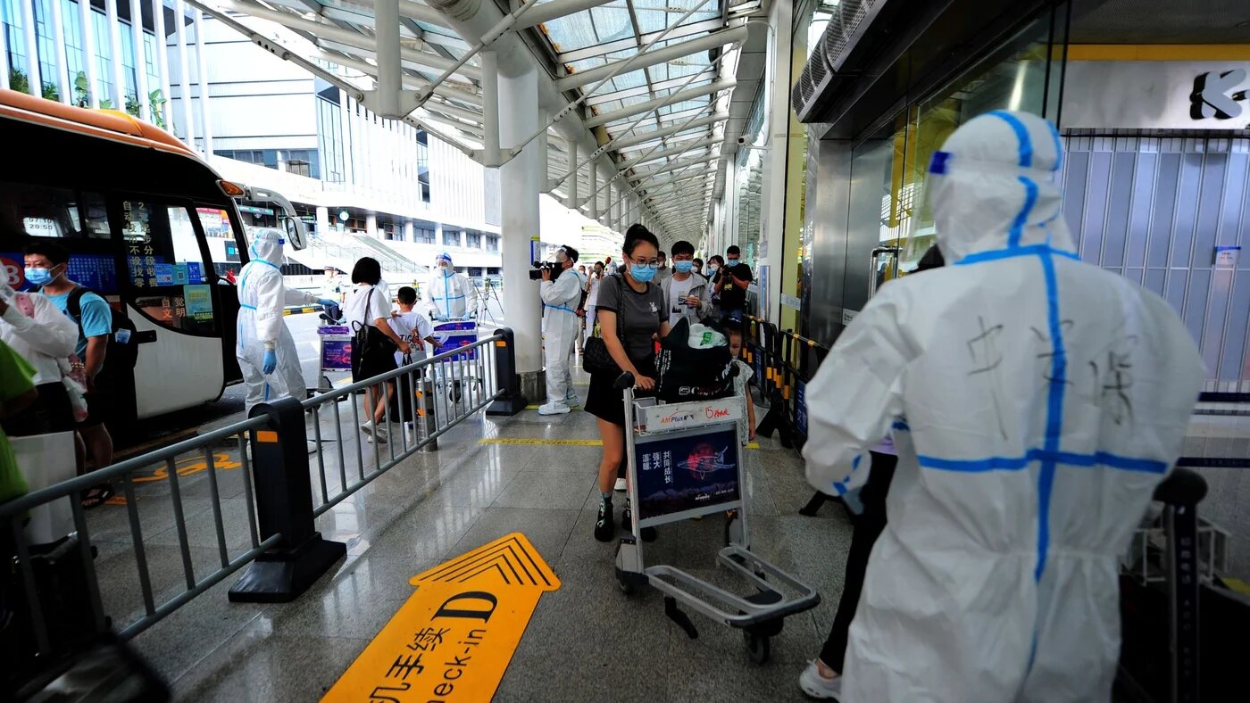 Tourists go through pre-departure formalities at the Sanya Phoenix airport as stranded holidaymakers prepare to leave the Covid-hit resort city of Sanya on Hainan Island on August 9, 2022 (AFP)