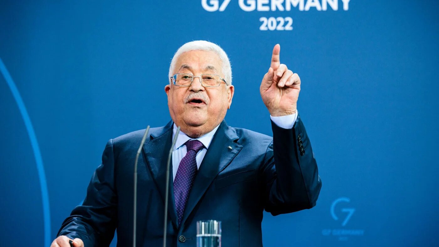 Palestinian president Mahmoud Abbas gesticulates during a joint press conference with the German Chancellor at the Chancellery in Berlin, Germany, on August 16, 2022 (AFP)