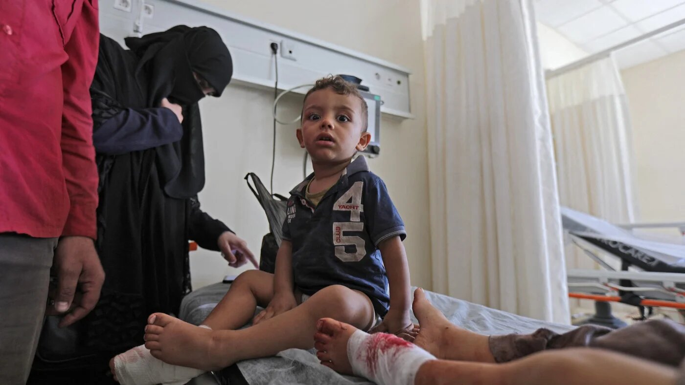 Children wounded in shelling during rebel infighting receive treatment at a hospital in al-Bab, 13 October (AFP)