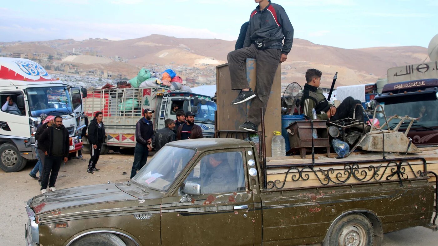 Syrians refugees prepare to leave Lebanon towards Syrian territory through the Wadi Hamid crossing in Arsal on October 26, 2022 (AFP)