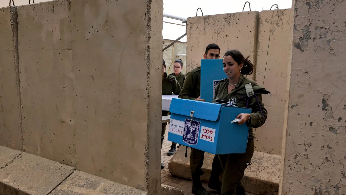 Israeli soldiers bring election equipment to facilitate voting for military members in the general elections, at the Har Dov military base on Mount Hermon, between Israel, Lebanon, and Syria, in the occupied Golan Heights on 31 October 2022 (Jalaa Marey/AFP)