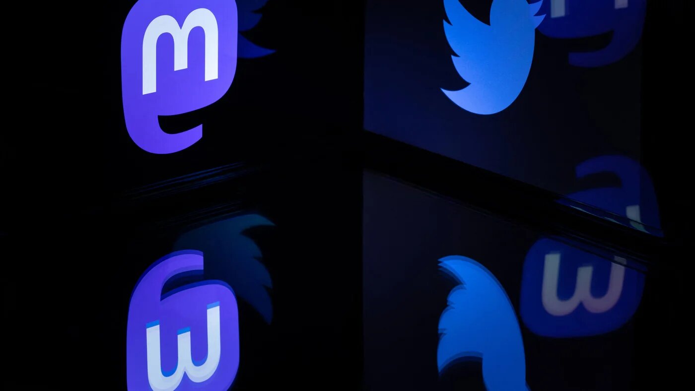 This photograph taken on November 7, 2022 shows the logos of social networks Twitter and Mastodon reflected in smartphone screens, in Paris (AFP)
