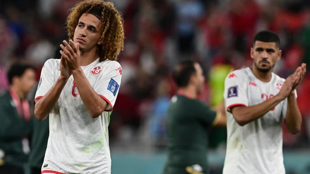 Tunisia's midfielder Hannibal Mejbri applauds after the finale whistle of the Qatar 2022 World Cup Group D football match between Denmark and Tunisia at the Education City Stadium in Al-Rayyan, west of Doha on 22 November 2022 (AFP)