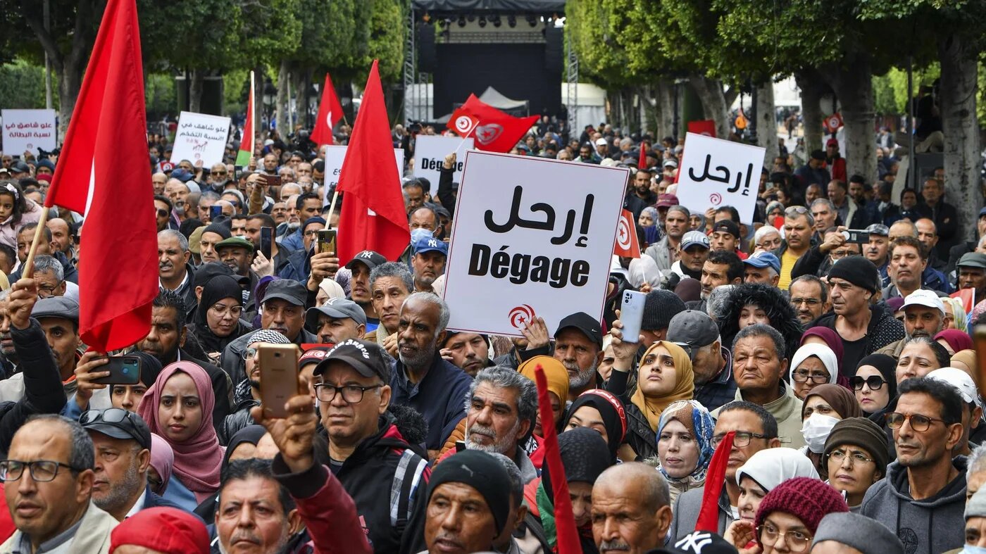 Tunisian demonstrators take part in a rally against President Kais Saied, called for by the opposition "National Salvation Front" coalition, in the capital Tunis, on December 10, 2022 (AFP)
