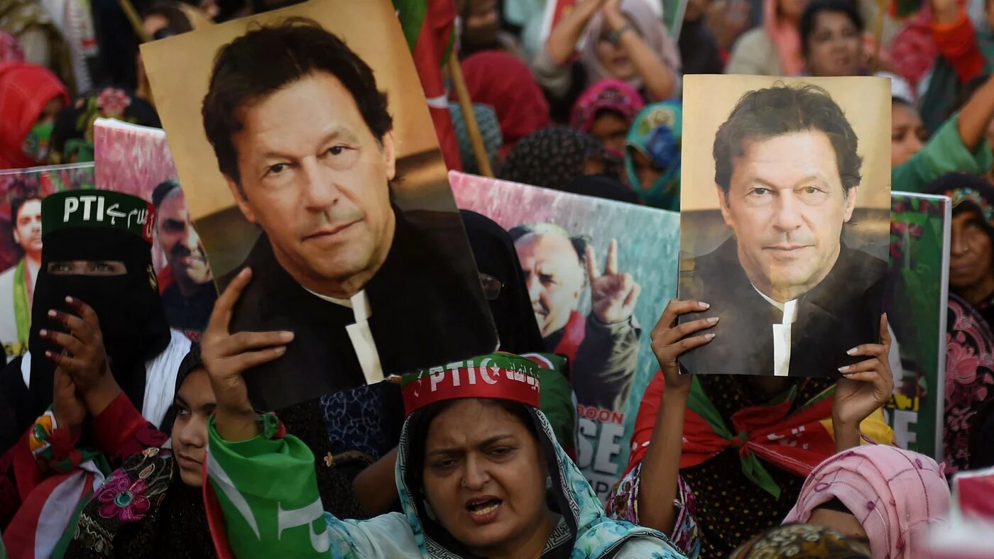 Supporters of Pakistan's former prime minister Imran Khan, carry placards displaying a portrait of Khan during a protest in Karachi on March 19, 2023, demanding release of arrested party workers in recent police clashes (AFP)