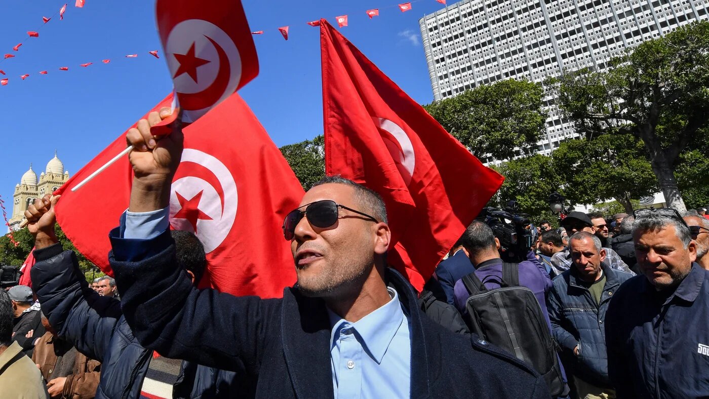 Tunisian demonstrators attend a rally against President Kais Saied