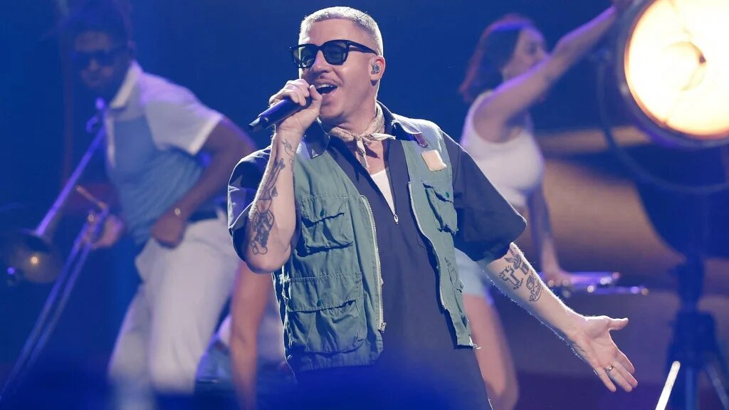 US rapper Macklemore performs during the opening ceremony of the 2023 Invictus Games at the Merkur Spielarena in Düsseldorf, western Germany on September 9, 2023.