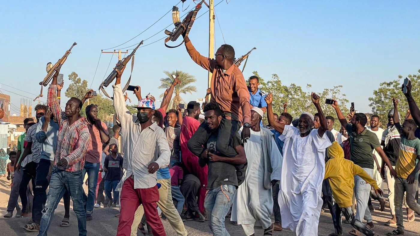 People rally in support of Sudan's army in Wad Madani on 17 December 2023, amid the ongoing war against the paramilitary Rapid Support Forces (AFP)