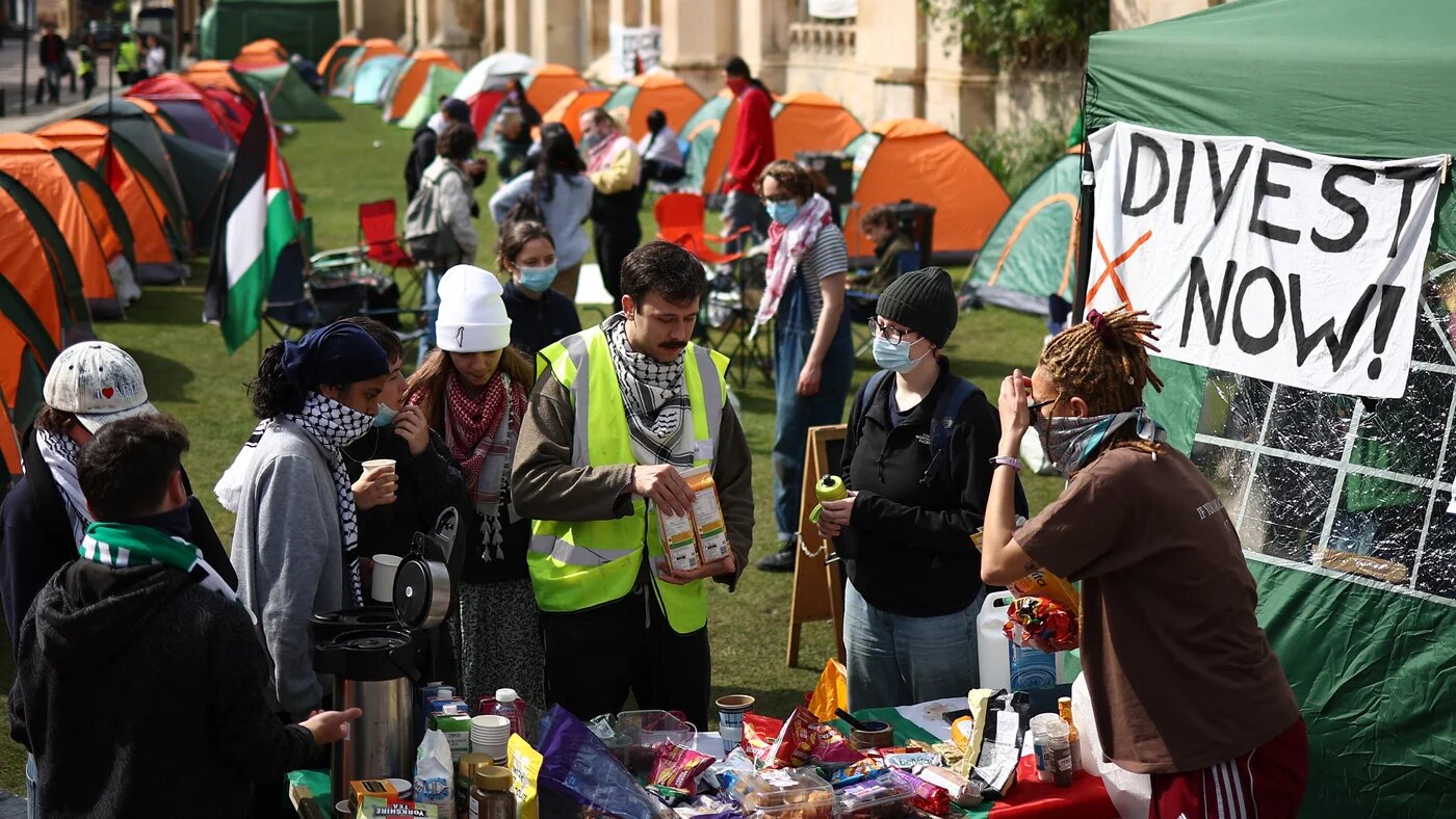 Students at the encampment on Cambridge's iconic King's Parade (AFP)