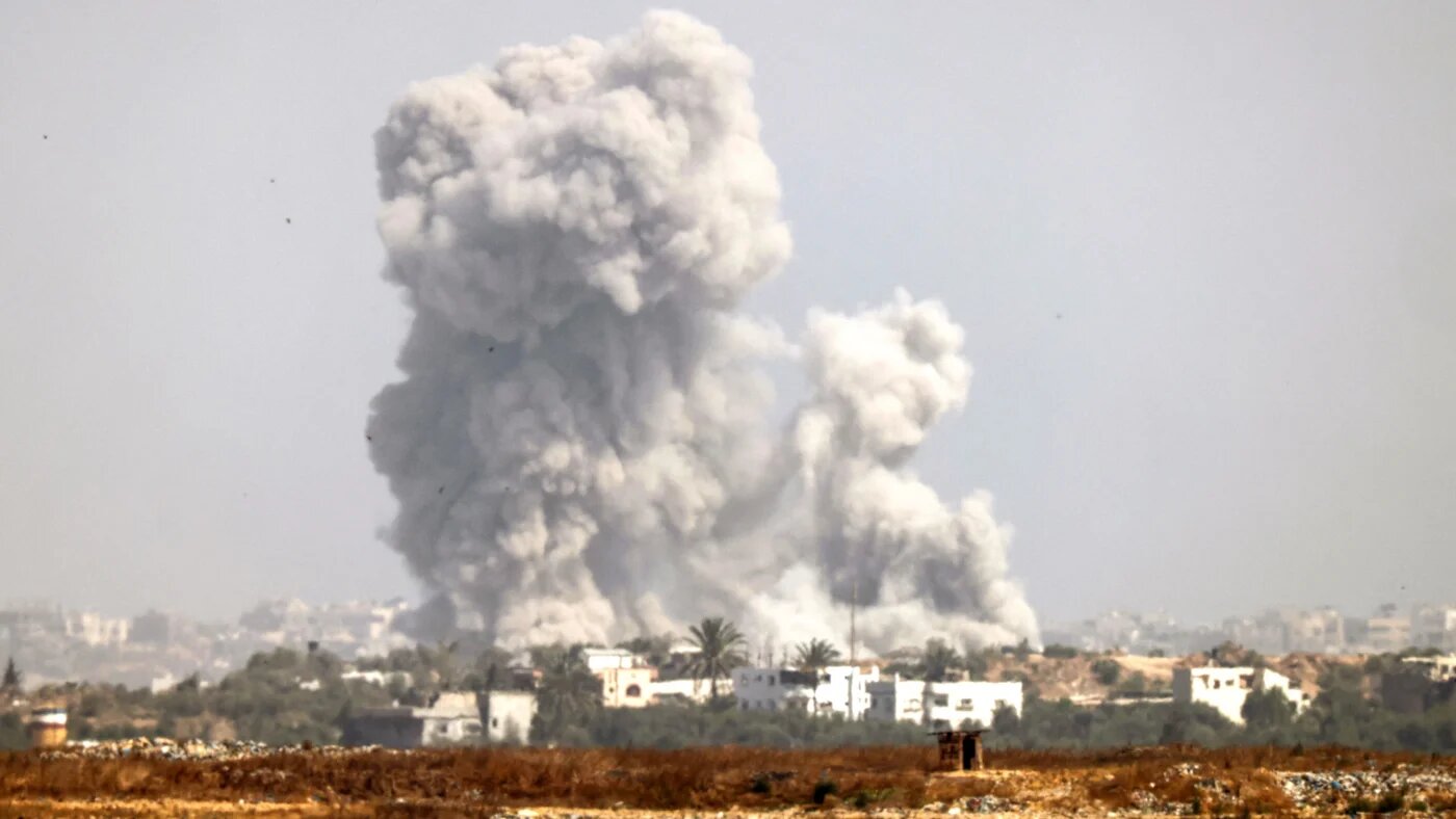 Smoke plumes billow from an explosion in the Gaza Strip on 21 May 2024 (AFP/Kacl Guez)
