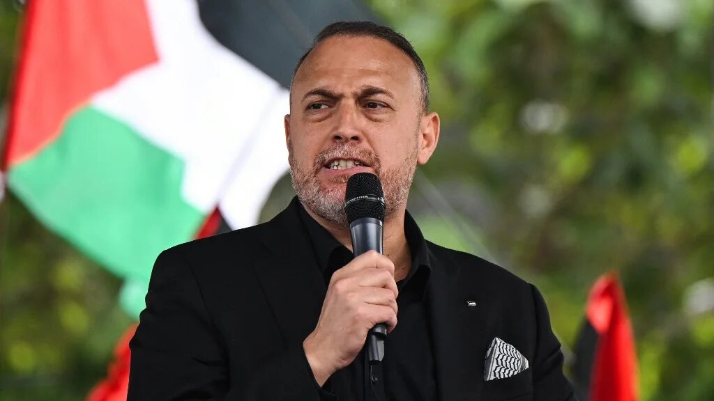 Palestinian Ambassador to the United Kingdom Husam Zomlot delivers a speech on Parliament Square, central London, on 8 June 2024 (AFP)