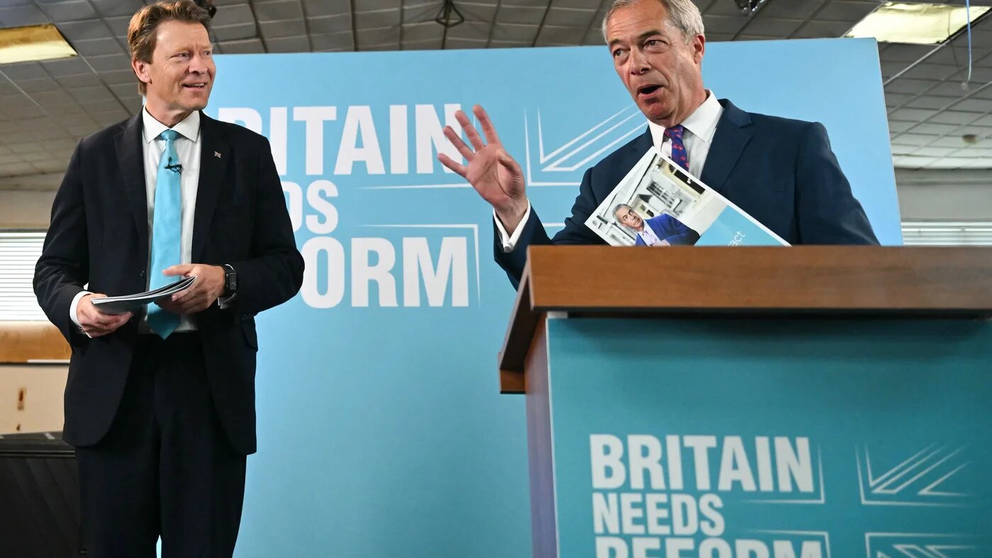 Reform UK leader Nigel Farage (right) and party chairman Richard Tice (left) at a campaign event (AFP)