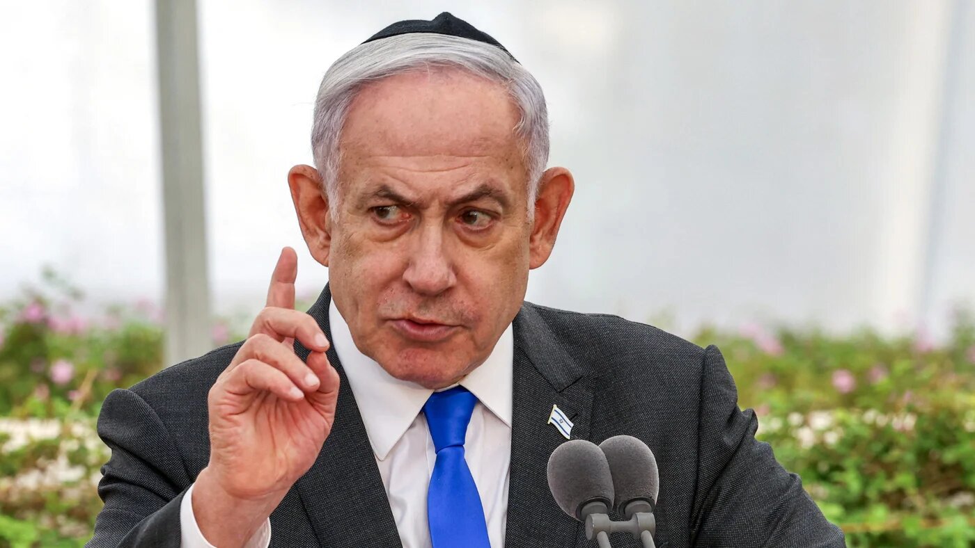 Israeli Prime Minister Benjamin Netanyahu speaks during a state memorial ceremony for the victims of the 1948 Altalena affair, at Nachalat Yitzhak cemetery in Tel Aviv on 18 June 2024 (AFP/Shaul Golan)