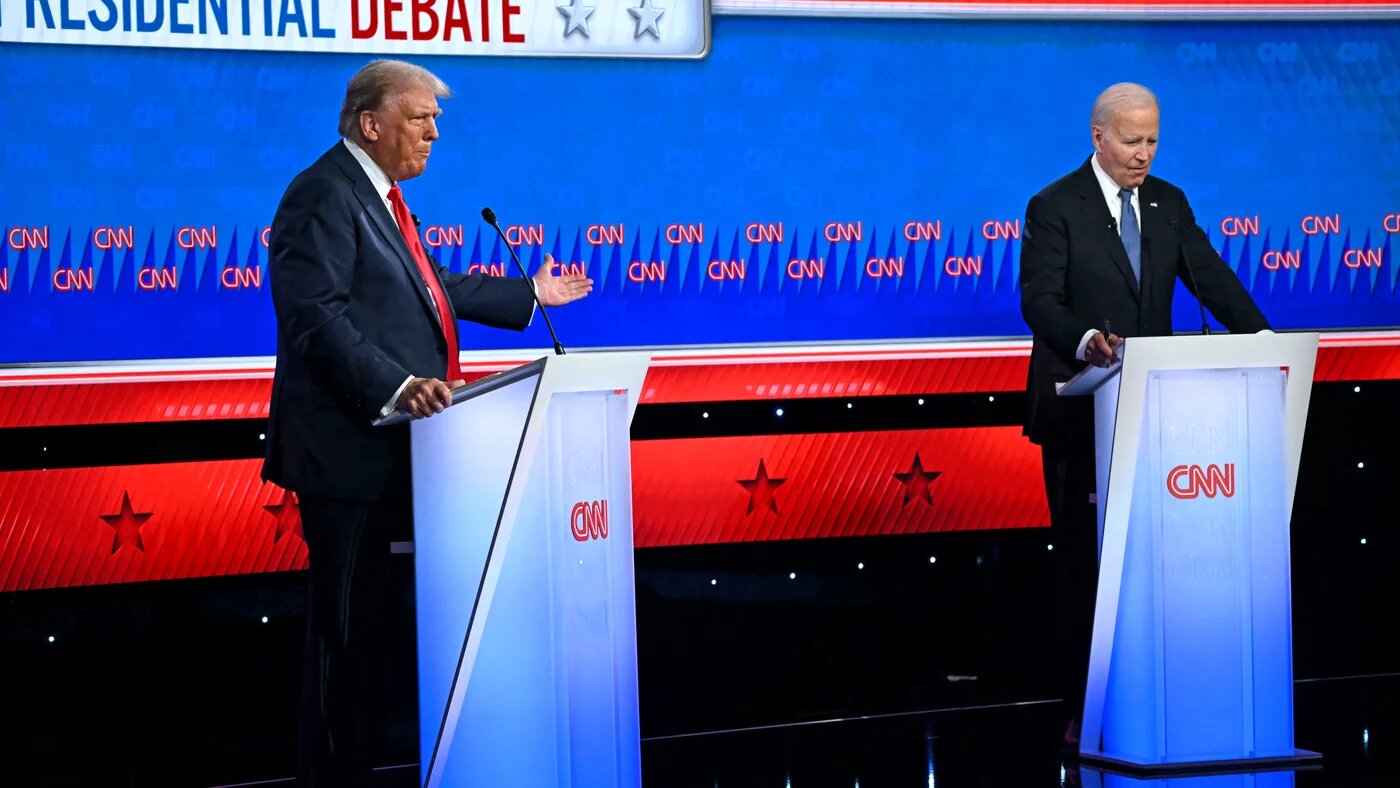 US President Joe Biden and former US President Donald Trump participate in the first presidential debate of the 2024 elections at CNN's studios in Atlanta (Andrew Caballero-Reynolds/AFP).