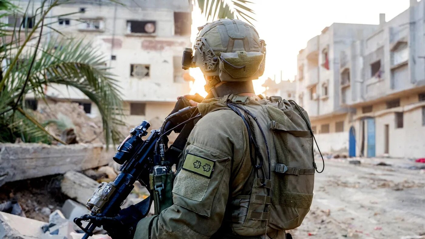 This handout picture released by the Israeli army on 15 July 2024, shows an Israeli soldier in the Gaza Strip (AFP/Israeli Army)