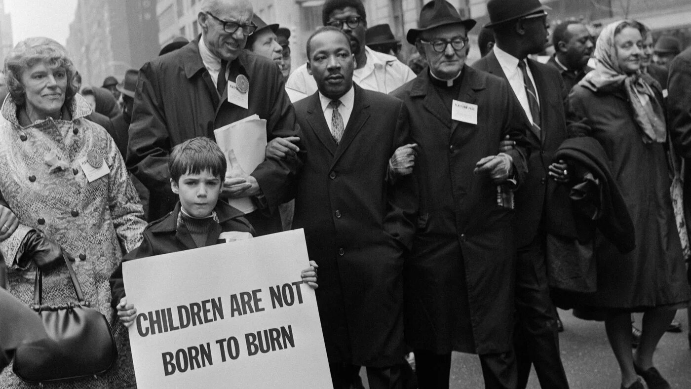 Civil rights leader Reverend Martin Luther King, centre, marches against the war on Vietnam during a demonstration in New York on 16 March 1967 (AFP)