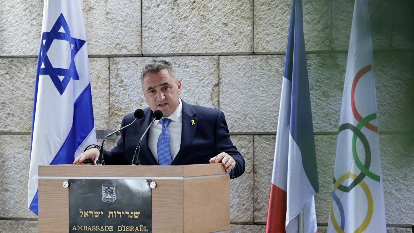 Israel's Ambassador to France Joshua Zarka  speaks during a ceremony to pay tribute to Israel's Olympic team victims in the Munich 1972 Games, at the Embassy of Israel in Paris on 6 August 2024 (Stephane De Sakutin/AFP)