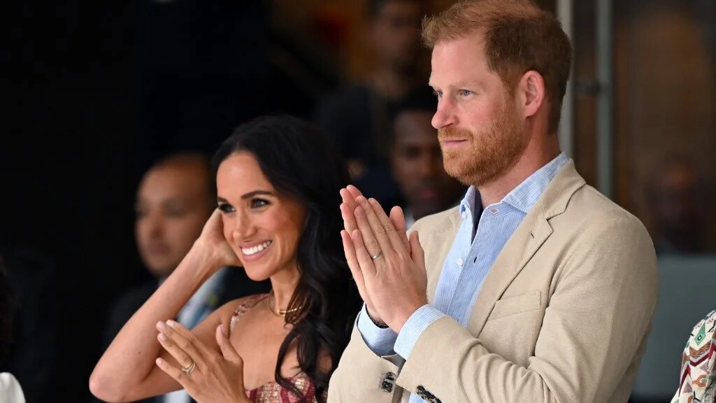 Britain's Prince Harry and his wife, Meghan Markle, attend a show in Bogota on 15 August 2024 (AFP)