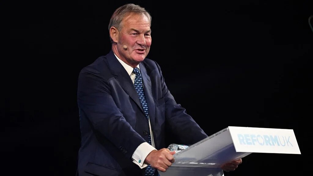 Rupert Lowe delivers a speech on the opening day of the Reform UK 2024 annual party conference in Birmingham on 20 September 2024 (AFP)