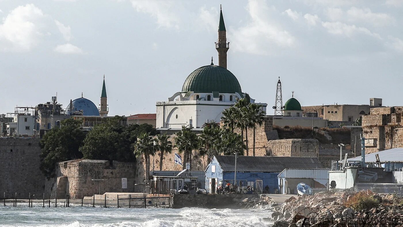 The 18th-century Ottoman-period al-Jazzar Mosque, also known as the 'White Mosque', is pictured in the old walled town of Acre in northern Israel on 1 October 2024 (AFP/Ahmad Gharabli)