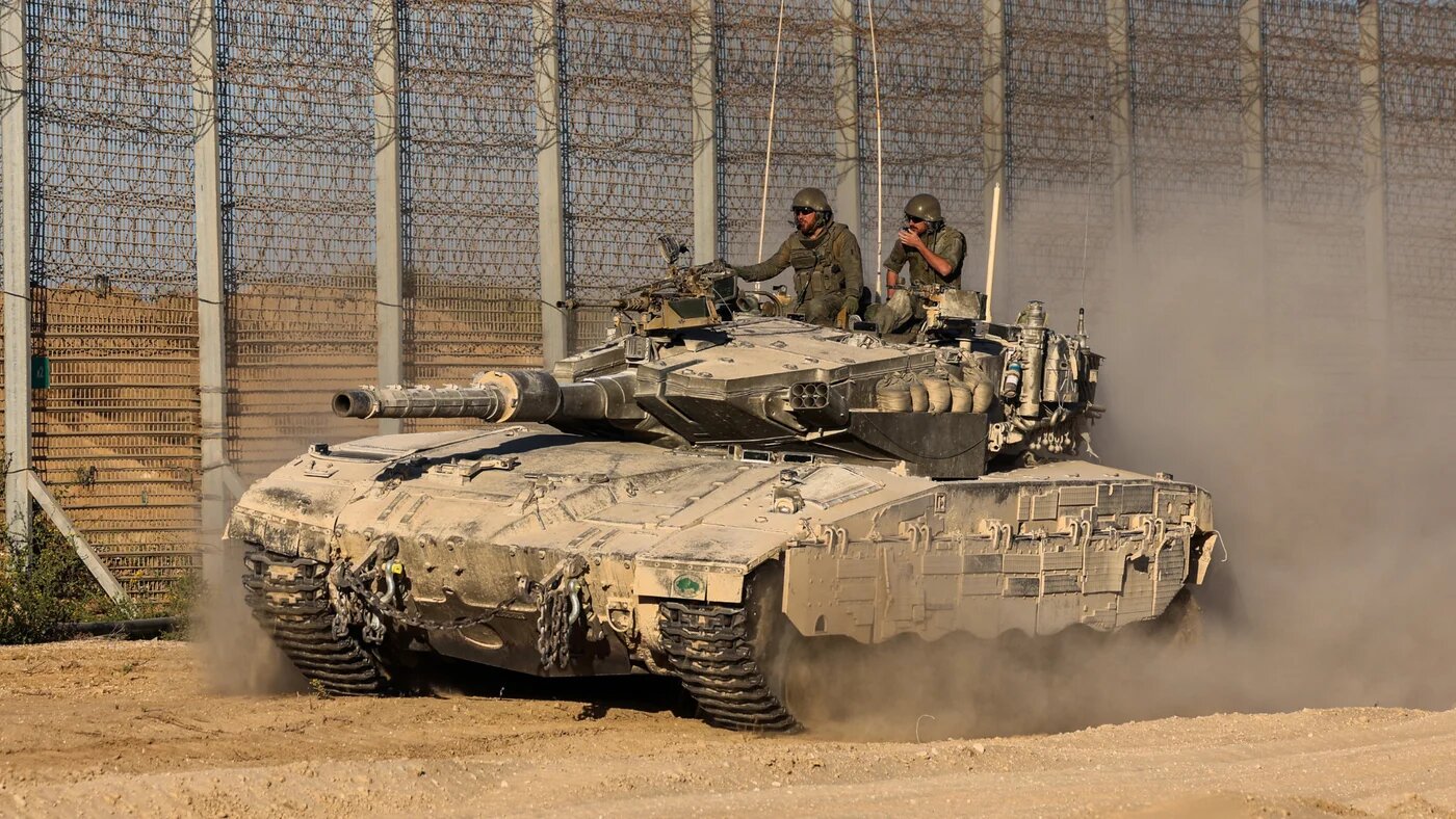 Israeli soldiers patrol in a tank along Gaza's boundary with Israel on 21 October 21, 2024 (AFP/Jack Guez)