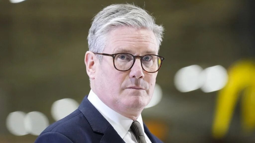 Britain's Prime Minister Keir Starmer reacts during an interview as he visits Airbus in Broughton, Flintshire, in north Wales on 15 November (AFP)