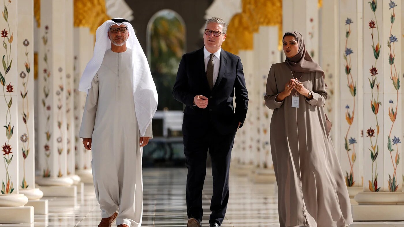 Britain's Prime Minister Keir Starmer tours Sheikh Zayed Grand Mosque with its director, General Yousef al-Obaidly, and a guide in Abu Dhabi during a visit to the UAE on 9 December 2024 (Kirsty Wigglesworth/Pool/AFP)