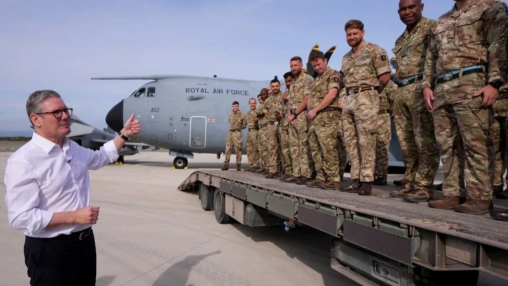 Britain's Prime Minister Keir Starmer talks to soldiers at the RAF base in Akrotiri on the southern coast of Cyprus on December 10, 2024 (AFP)