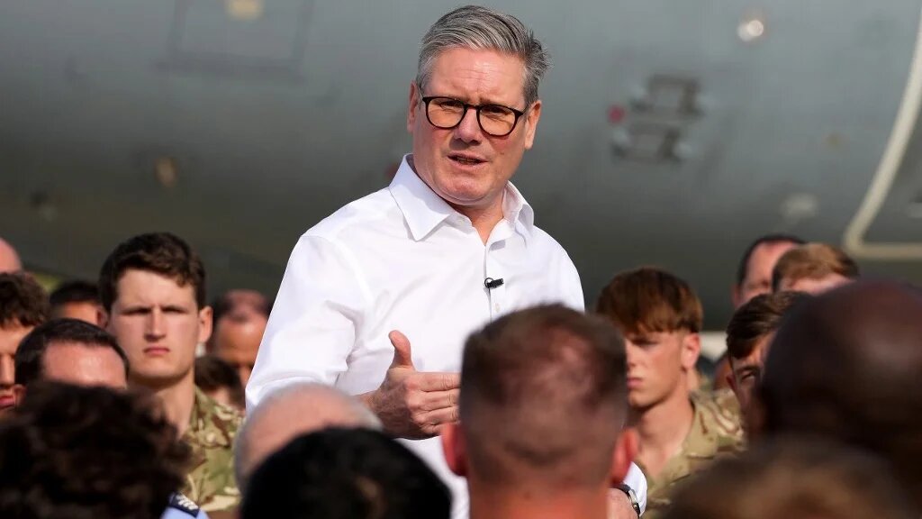 Britain's Prime Minister Keir Starmer talks to soldiers at the RAF base in Akrotiri on the southern coast of Cyprus on 10 December 2024 (AFP)