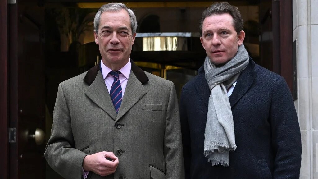 Former Conservative donor Nick Candy (R) poses for a photo with Reform UK leader Nigel Farage (L) in central London on 10 December 2024