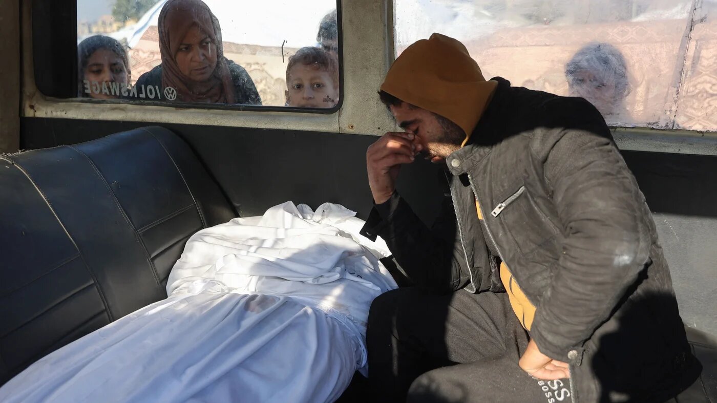 A Palestinian man mourns the death of a relative in Gaza City on 1 January 2025 (AFP/Omar al-Qattaa)