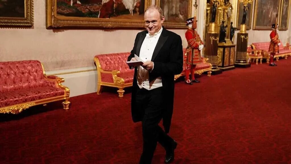 Britain's Liberal Democrat party leader Ed Davey arrives to attend State Banquet for Emir of Qatar at Buckingham Palace in London on 3 December 2024 (AFP)