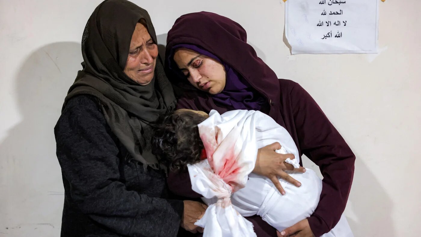 A Palestinian mother cradles the body of her daughter Ibtissam Elyan, who was killed when an Israeli air strike hit the family home in Beit Lahia in the northern Gaza Strip on 25 March 2025 (Bashar Taleb/AFP)