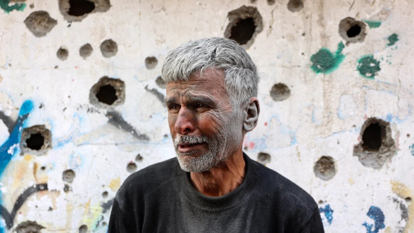 An elderly Palestinian man reactsas he stands in front of a building hit by an Israeli strike, in Gaza City's eastern neighbourhood of Shujaiya on 10 April 2025 (AFP/Omar al-Qattaa)