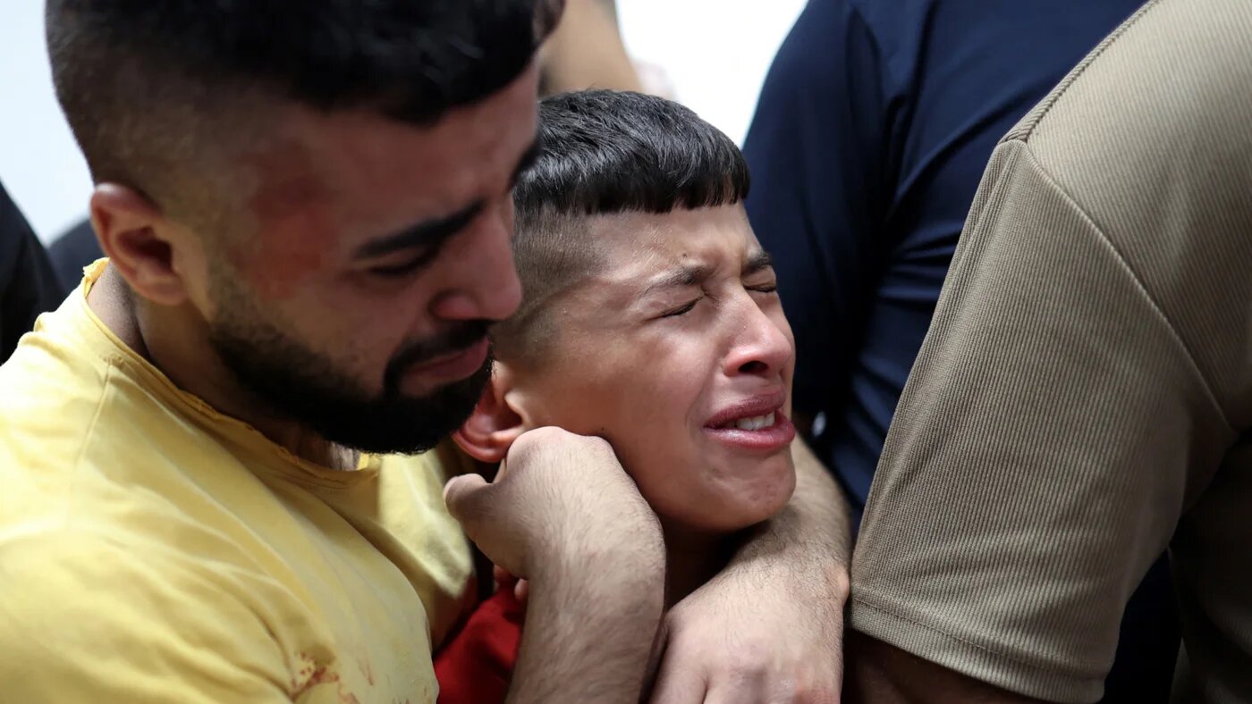 Relatives mourn 14-year-old Ammar Motaz Hamayel after he was killed during an Israeli raid in Kafr Malik, in the occupied West Bank, on 23 June 2025 (Zain Jaafar/AFP)