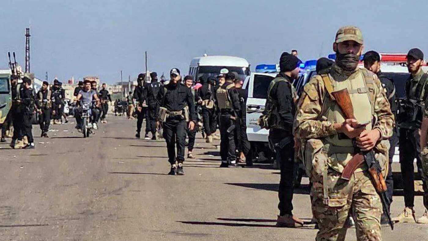 Syrian army and security forces can be seen in Sweida on 14 July 2025 following clashes between Druze militias and Bedouin tribes (Sana/AFP)