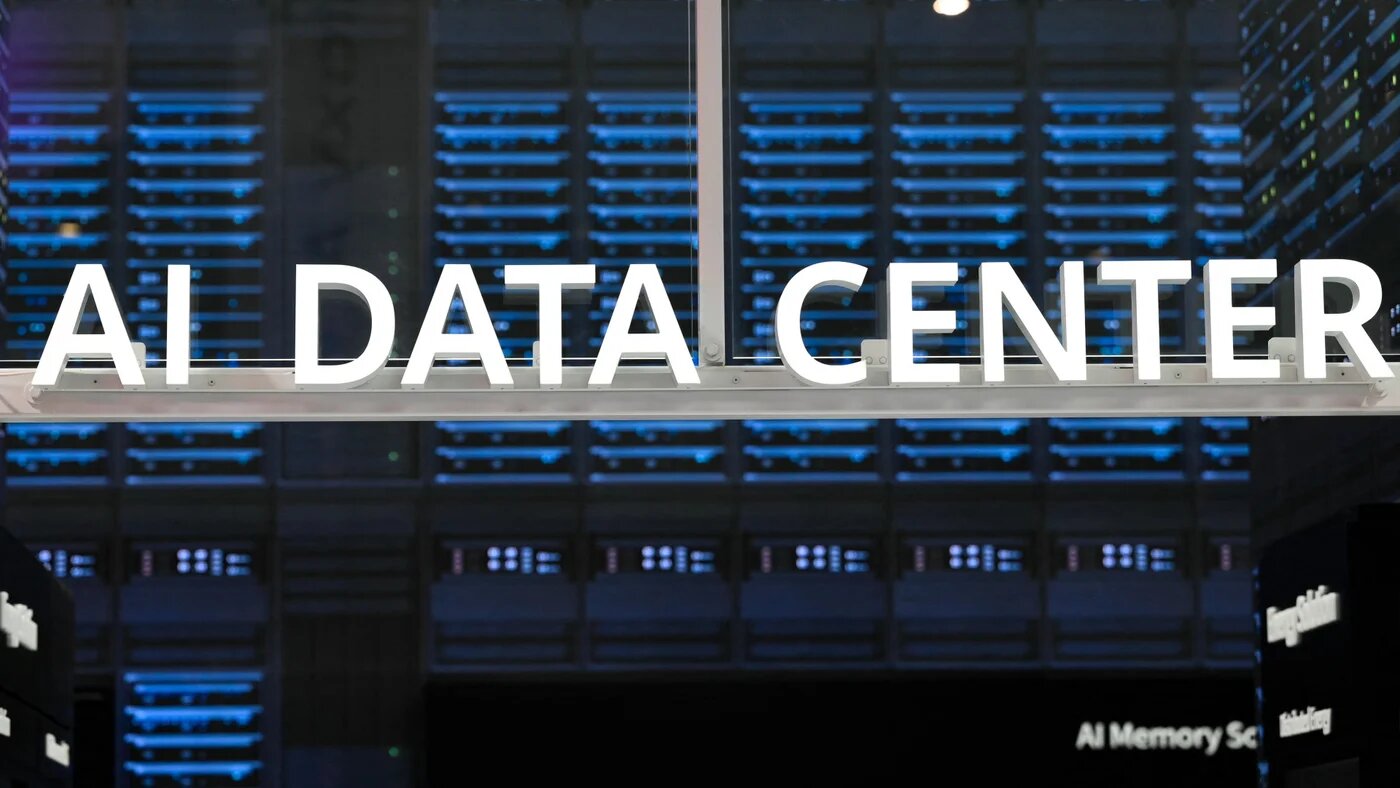 Signage of an AI data centre is displayed at the Mobile World Congress in Barcelona, 3 March 2025. US tech firms and China are turning to nuclear development to meet surging AI energy demands (Josep Lago/AFP)
