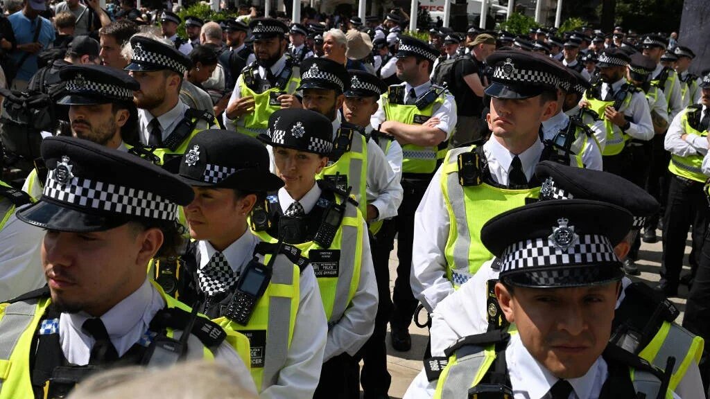 Members of the Metropolitan Police gather in Parliament Sqaure ahead of a "Lift The Ban" demonstration in support of Palestine Action, London, 9 August (AFP)
