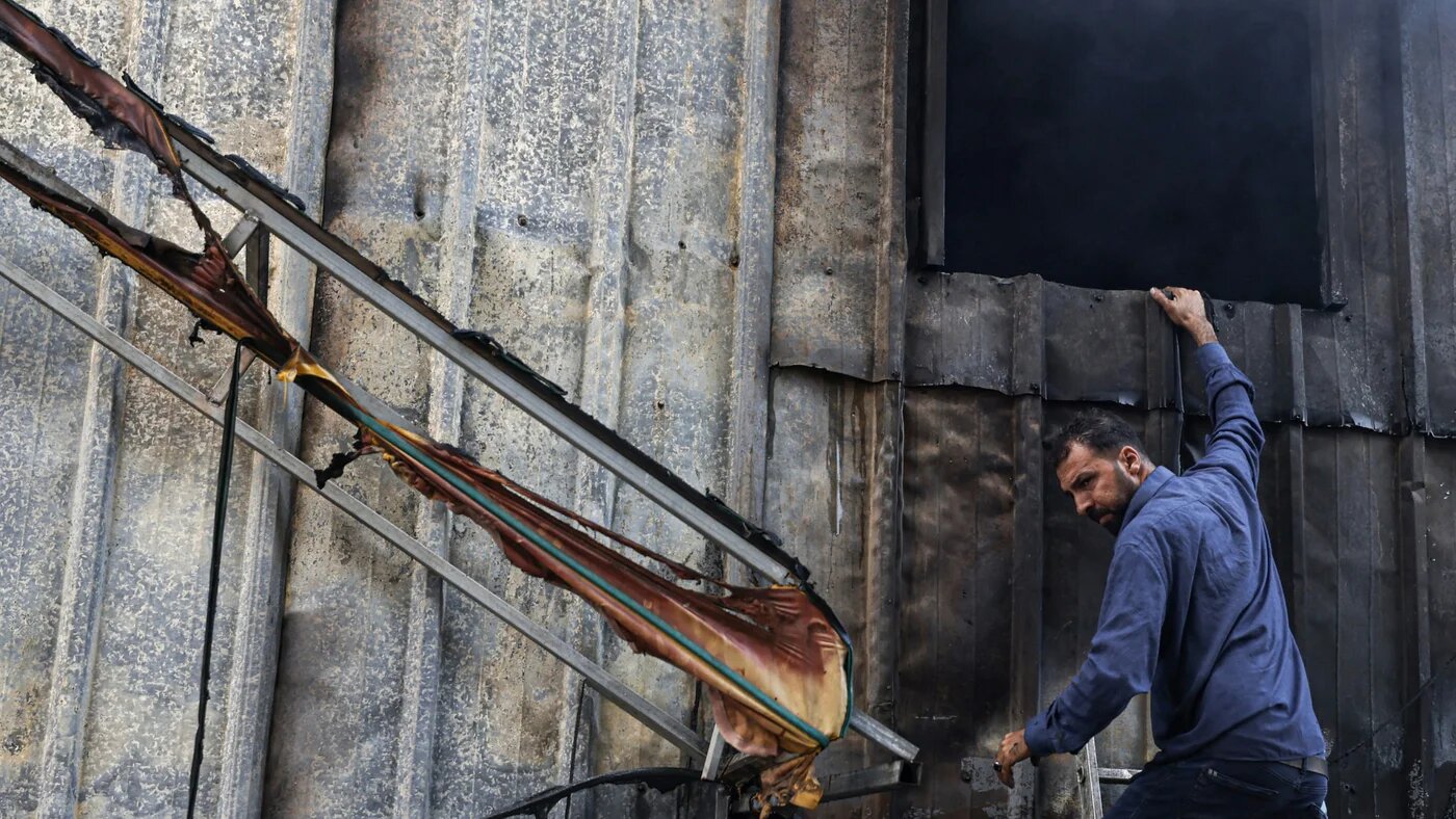 A Palestinian man inspects the damage at the site of an Israeli settlers attack on a plant nursery in the village of Deir Sharaf, west of Nablus, in the occupied West Bank on 9 September 2025 (AFP/Jaafar Ashtiyeh)