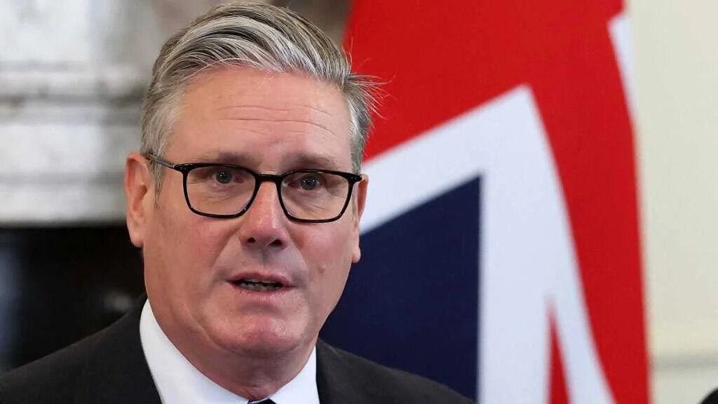 Britain's Prime Minister Keir Starmer sits in front of a Union flag as he chairs a meeting of his Cabinet Ministers inside 10 Downing Street, in central London, on September 9