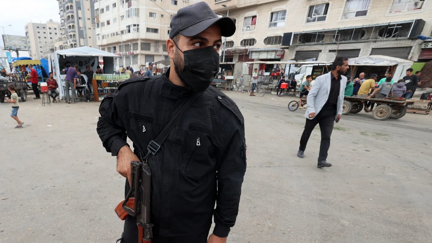 A member of the internal security forces loyal to the Palestinian group Hamas, mans a checkpoint in the Nuseirat refugee camp in the central Gaza Strip, on 12 October 2025 (AFP/Eyad Baba)