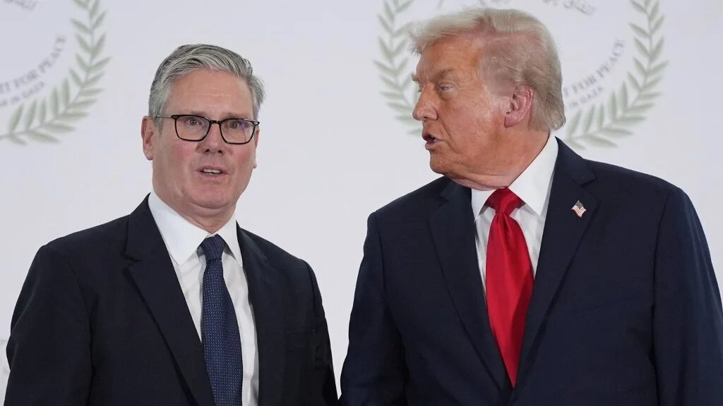 US President Donald Trump greets Britain's Prime Minister Keir Starmer during a summit on Gaza in Sharm el-Sheikh on October 13, 2025.
