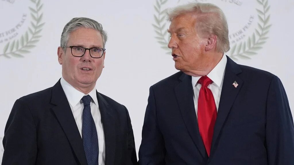 US President Donald Trump greets Britain's Prime Minister Keir Starmer during a summit on Gaza in Sharm el-Sheikh on October 13, 2025.