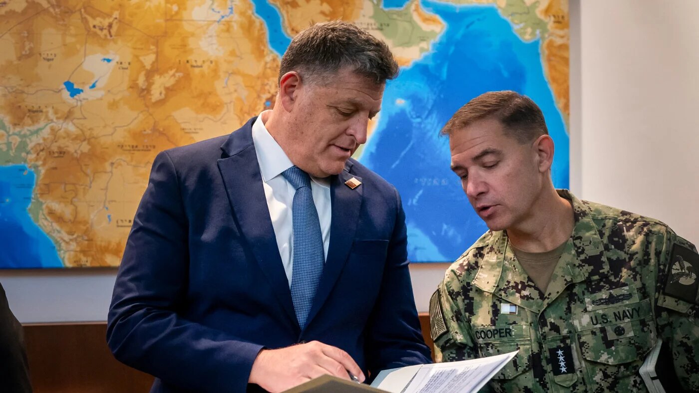 United States Central Command chief Brad Cooper (right) speaks with Ofir Falk (left), diplomatic adviser to the Israeli prime minister, in Jerusalem on 22 October 2025 (AFP/Nathan Howard)
