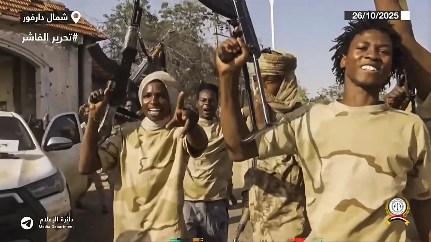 This image grab taken from video footage released on the Rapid Support Forces Telegram account on 26 October 2025, shows RSF fighters celebrating in the streets of el-Fasher (RSF)