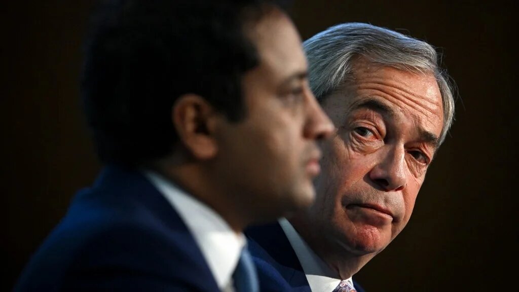 Reform UK leader Nigel Farage (R) attends a press conference with Zia Yusuf in London on November 18, 2025.