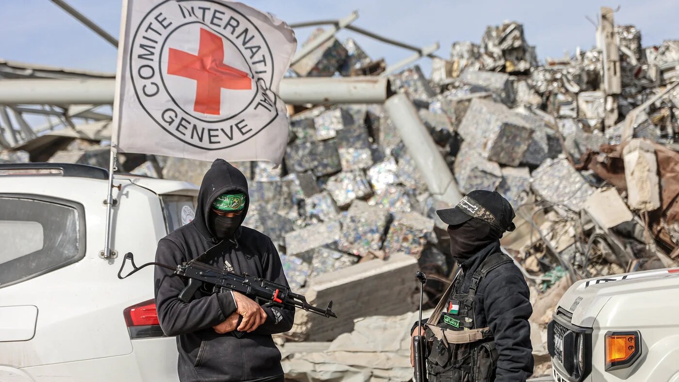 Hamas fighters secure the area as Egyptian workers and Red Cross officials search for the remains of the last Israeli captive, in the Zeitoun neighbourhood of Gaza City, on 8 December 2025